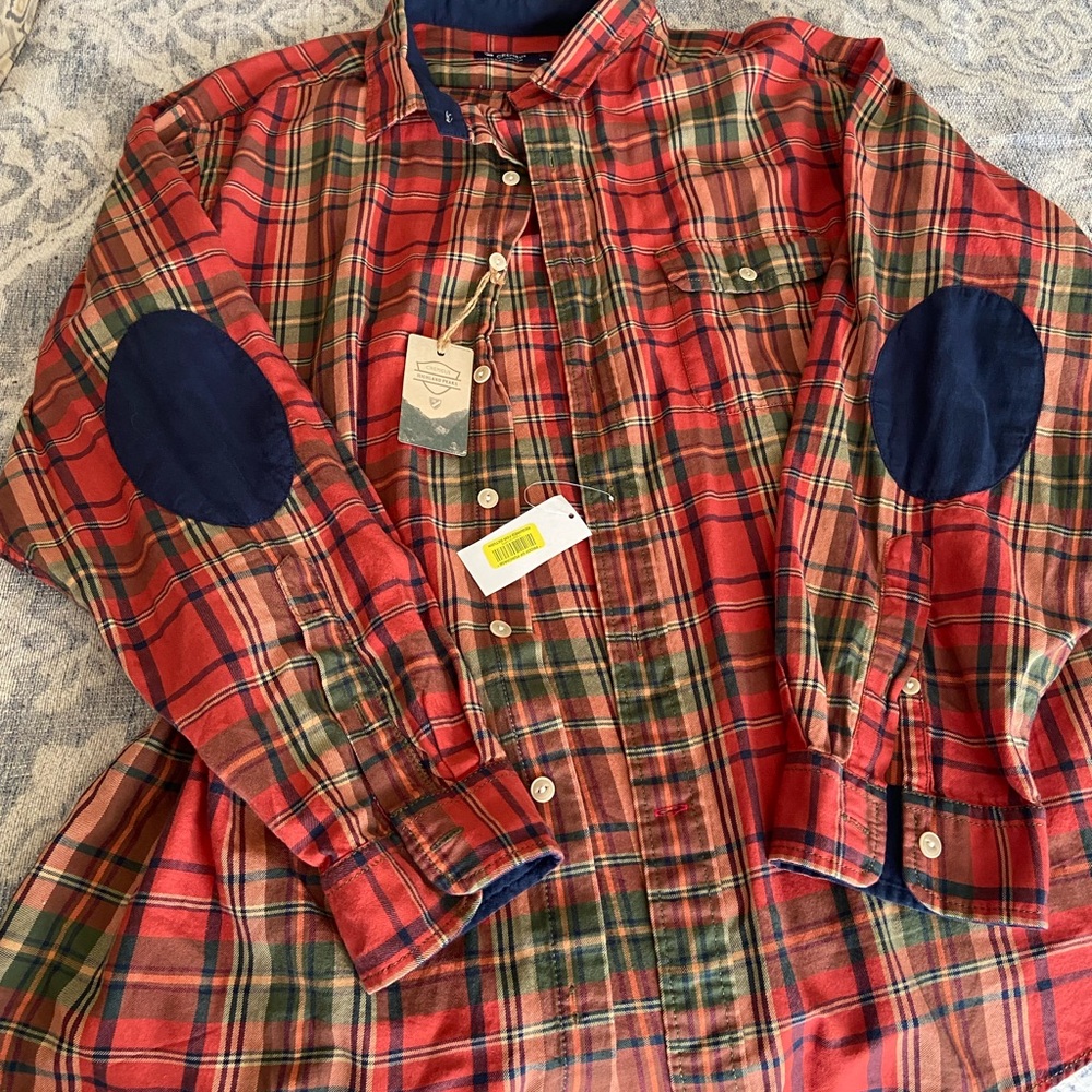 Mens button down collar shirt with elbow patch.